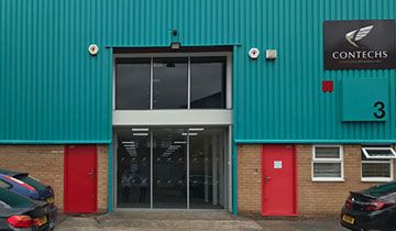 picture of the outside of a warehouse unti recently painted